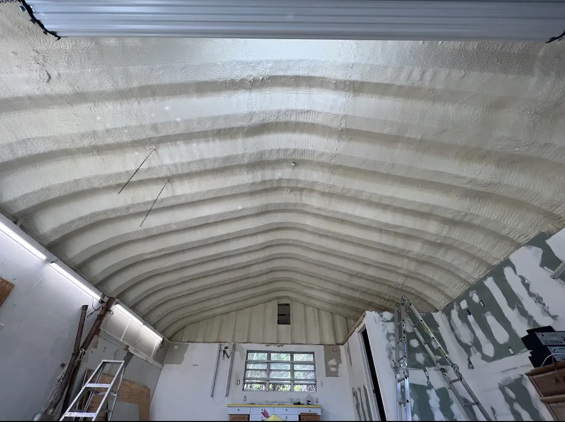 Spray polyurethane foam applied to the underside of a metal roof deck in Grosse Pointe Park